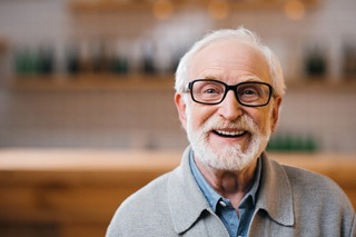 An older man smiling