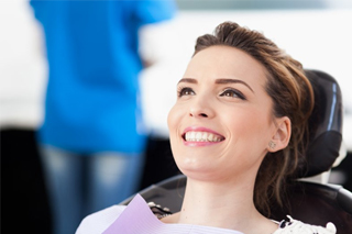 woman smiling at cosmetic dentist in Fort Worth 