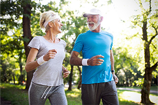 Older couple enjoying benefits of dental implants in Fort Worth