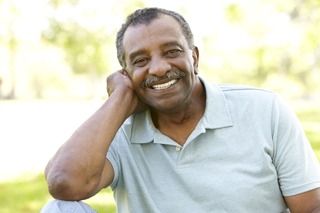 An older man smiling