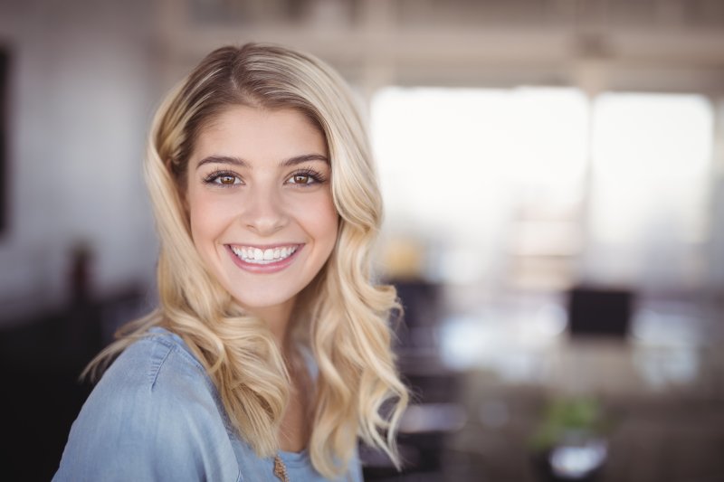 patient who got a bone graft for dental implants smiling