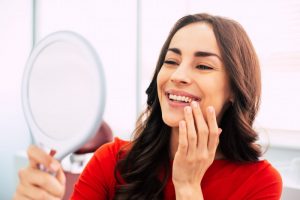 Woman smiling with dental implants